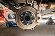 Straight-on view of Forged Alloy 2 inch 6x5.5 wheel spacer mounted on Silverado hub